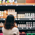 a person shopping for eco-friendly beauty products in a health food store