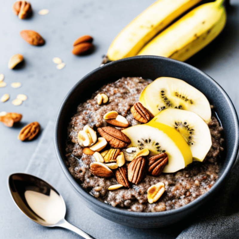 A bowl of oatmeal topped with sliced bananas, chia seeds, and nuts
