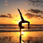 Do yoga on the beach